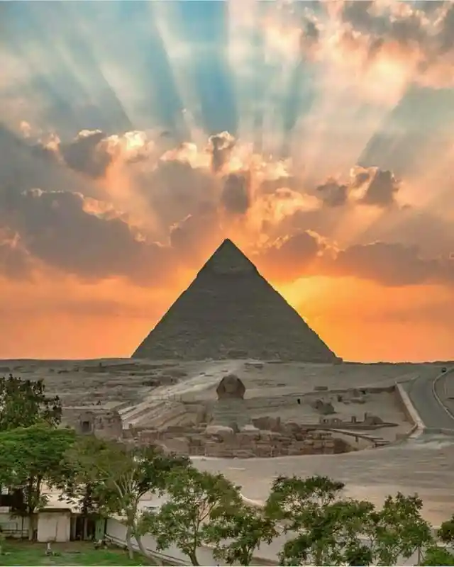 The sunset over the Giza Pyramids, as seen from Cairo