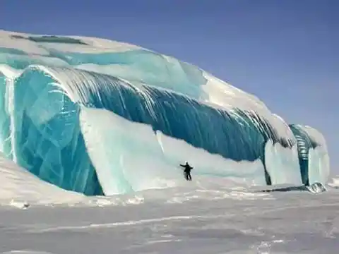 A stunning 50-ft blue ice monolith in the Antarctic