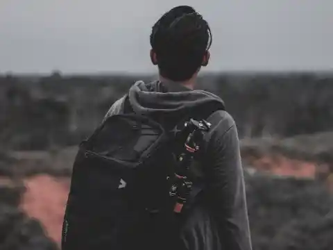 Putting Something In His Backpack